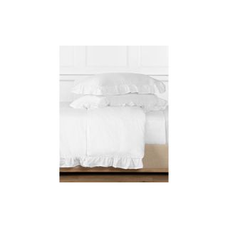 white linen bedding with ruffles
