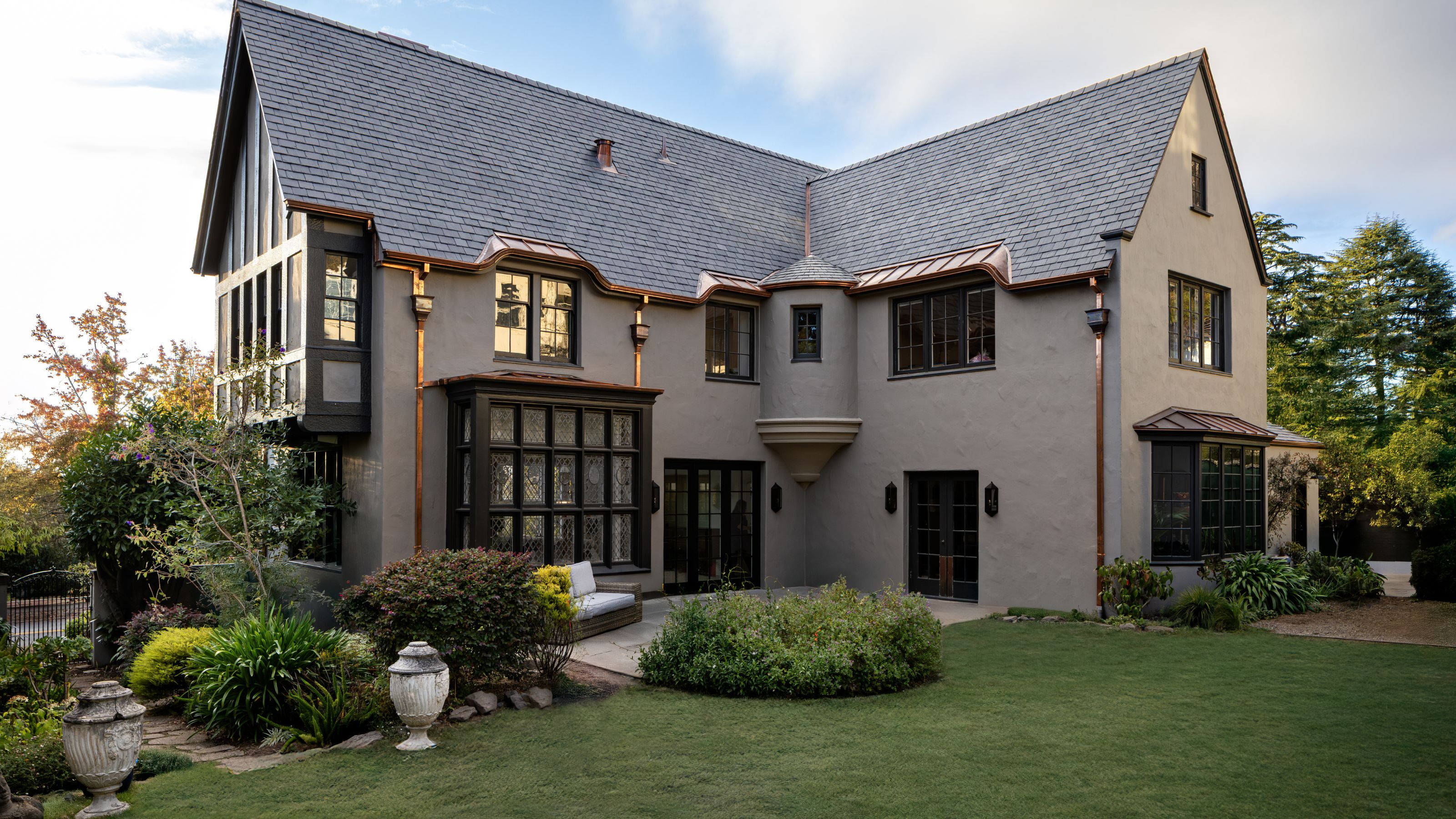 a rear exterior of a 1915 tudor home in california