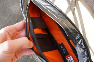 Internal sleeves and strap inside Restrap’s Race Top Tube Bag
