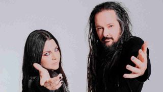Evanescence’s Amy Lee and Korn’s Jonathan Davis leaning towards the camera with hands outstretched
