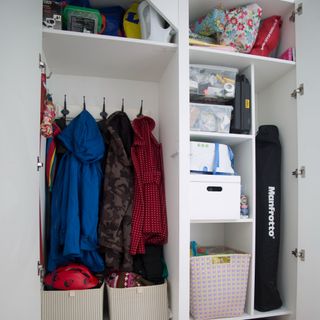 A wardrobe with storage boxes