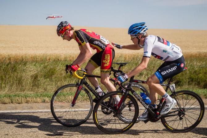 Jim Stemper (Kenda-5 Hour Energy) gets a helping hand from eventual stage winner Rohan Dennis (Garmin-Sharp).