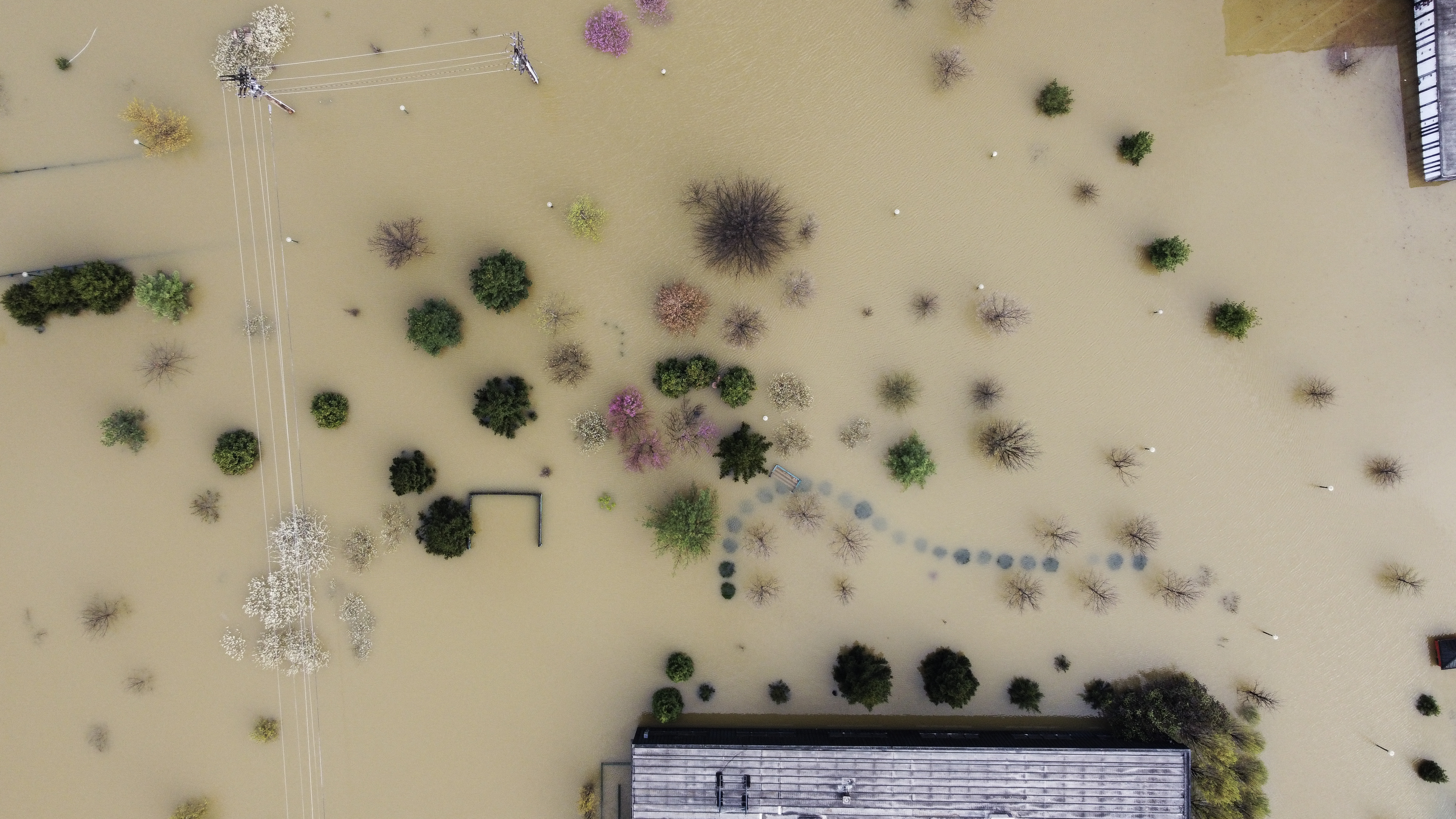 an aerial view of a neighborhood filled with floodwater