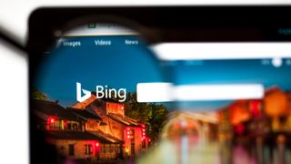 Bing.com website homepage viewed through a magnifying glass
