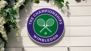 The Wimbledon logo surrounded by flowers