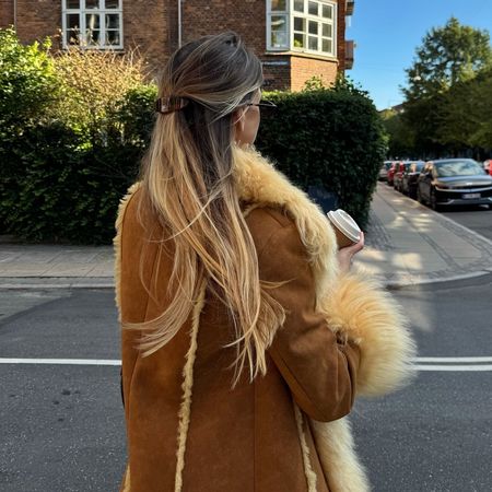 Anna Winck with brown hair and blonde highlights