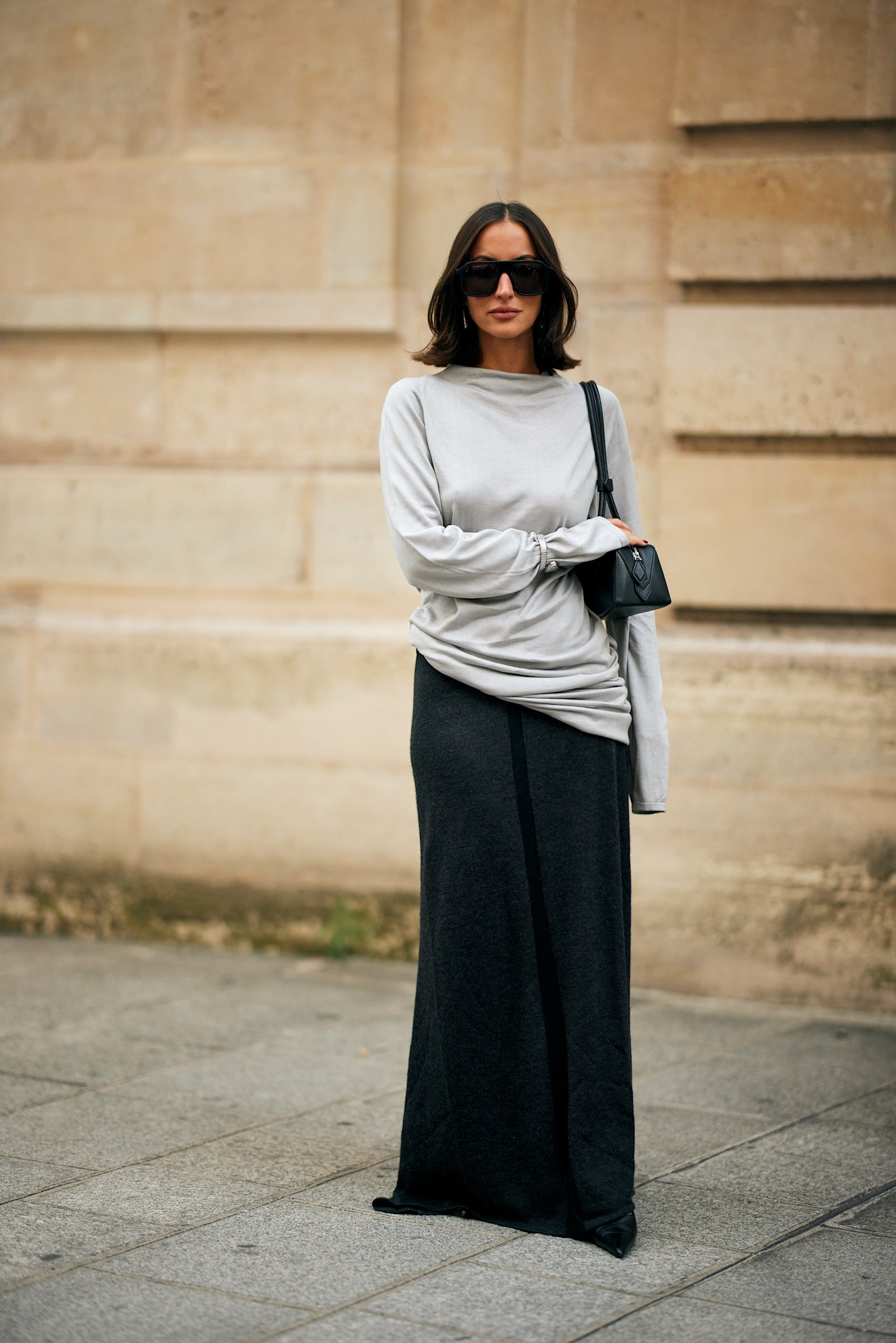 woman wearing draped top and skirt