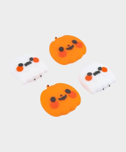 Image of little controller thumbsticks based on ghosts and pumpkins, with a plain gray background.