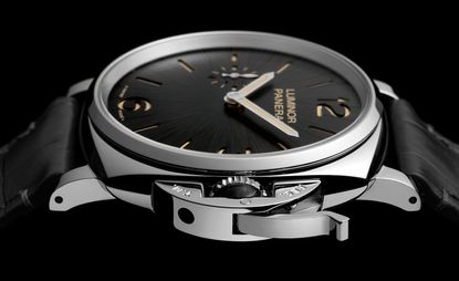 Closeup of Panerai’s ’Due’ watch face. Black face with silver hands and rim.