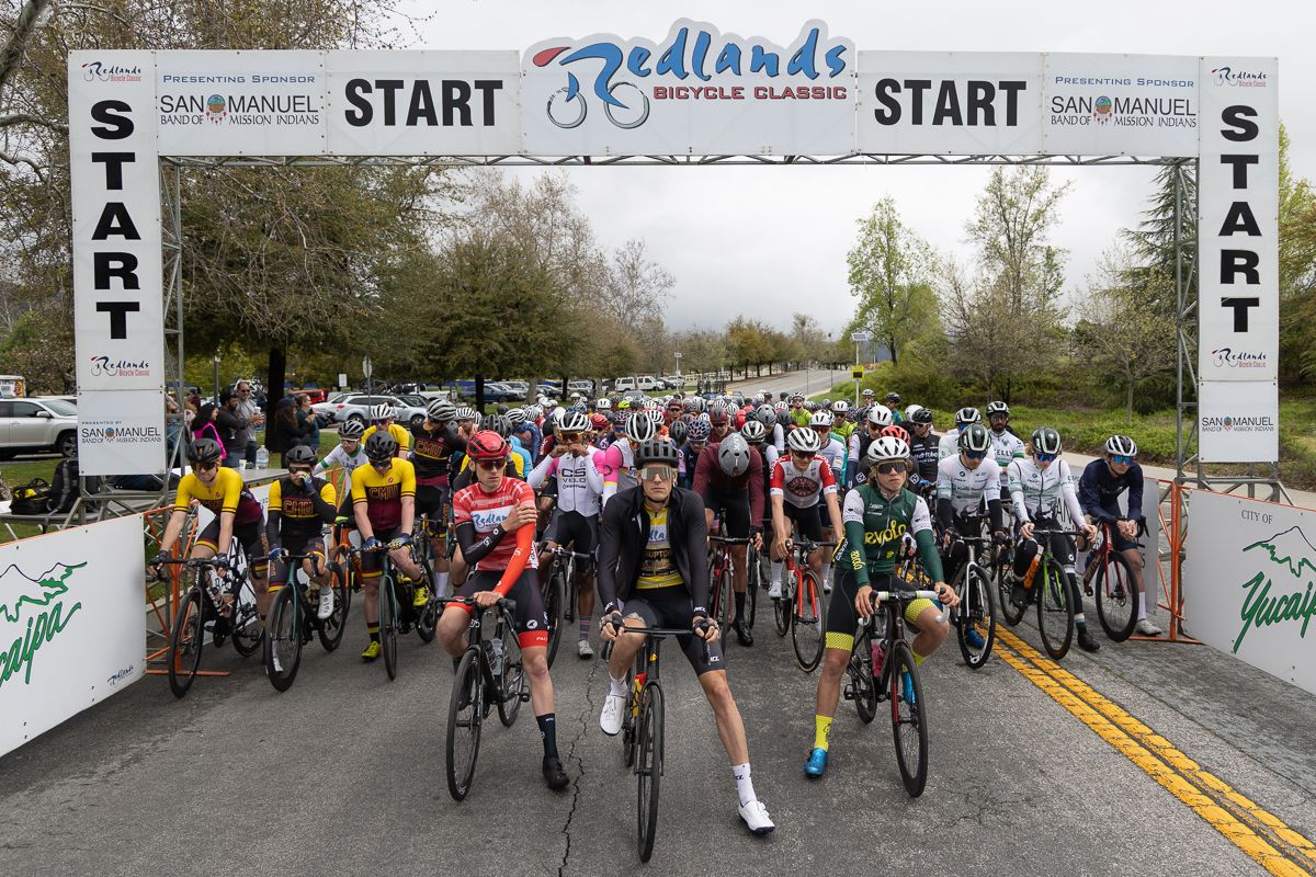 Red, Yellow, and White jerseys on the start line of the men's race Thursday