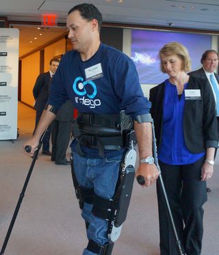 Michael Gore walks with the Indego Exoskeleton