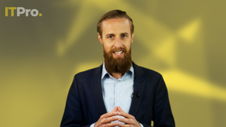 Presenter Ant Joblin on a yellow background talking to the camera