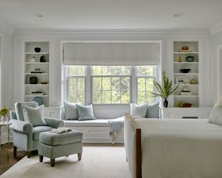 calming bedroom with neutral and pale blue decor