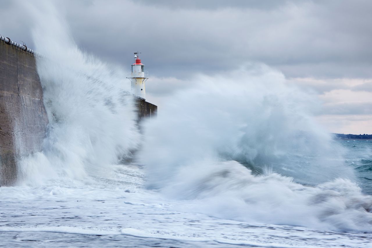 Large waves colliding into the sea wall at Newlyn