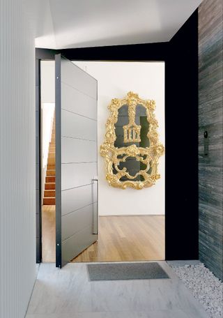 Front door opens on Jeff Koons’ 1988 Wishing Well ornate golden mirror