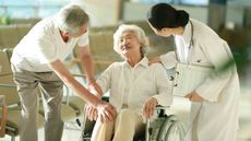 Senior couple talking with doctor in a nursing home