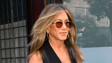 Jennifer Aniston wearing black suit trousers and waistcoat top partywear look in New York City on 8 September, 2025