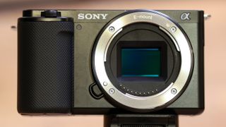 Close-up of the front of the Sony ZV-E10 without a lens