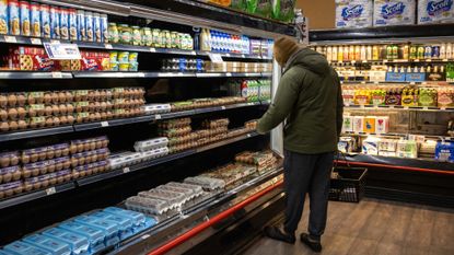 Man looks at egg prices
