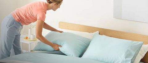 Casper Foam Pillow with Snow Technology pillow being arranged on bed