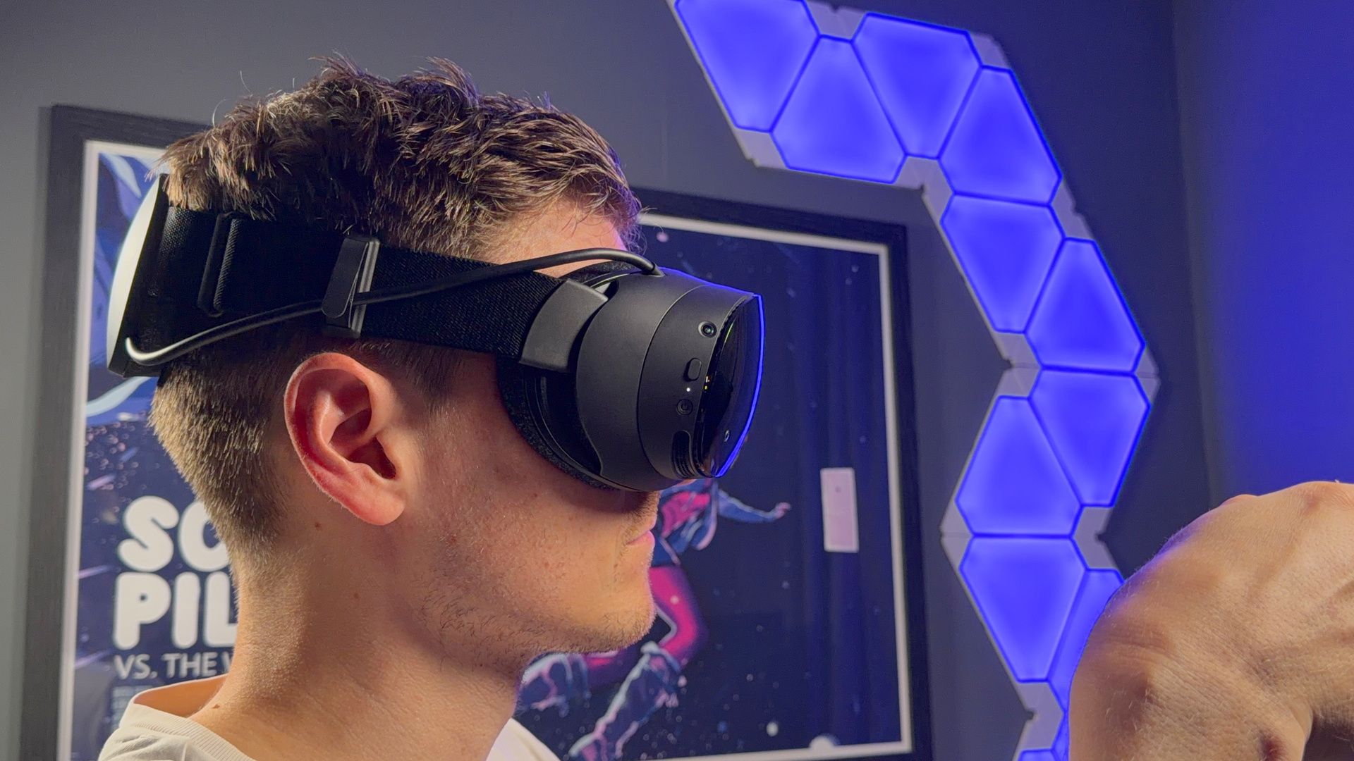 Jacob Ridley, Managing Editor for Hardware at PC Gamer, wearing the Steam Frame on his head.