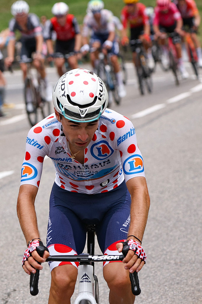 Bahrain - Victorious team's French rider Lenny Martinez wearing the best climber's polka dot (dotted) jersey cycles ahead of the pack of riders (peloton) in the ascent of Col du Tourmalet during the 14th stage of the 112th edition of the Tour de France cycling race, 182.6 km between Pau and Luchon-Superbagneres, in the Pyrenees mountains of southwestern France, on July 19, 2025. (Photo by Anne-Christine POUJOULAT / AFP)
