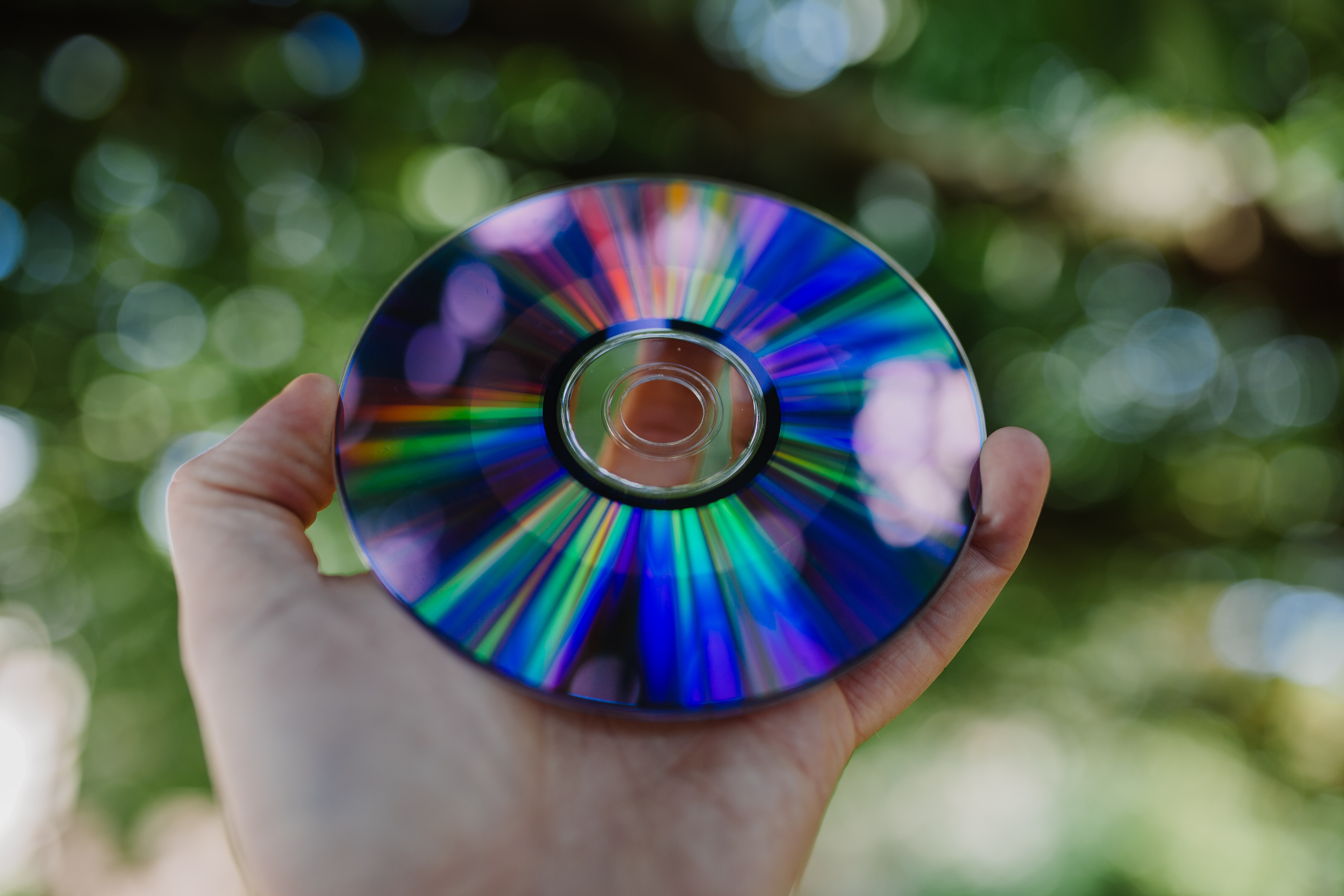 Disc held in male hands outdoors