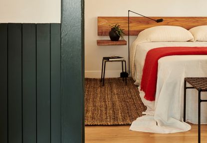 Red and white bed linen on a bed