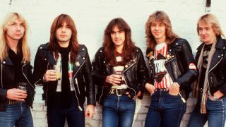 Iron Maiden in 1982 holding pints of beer