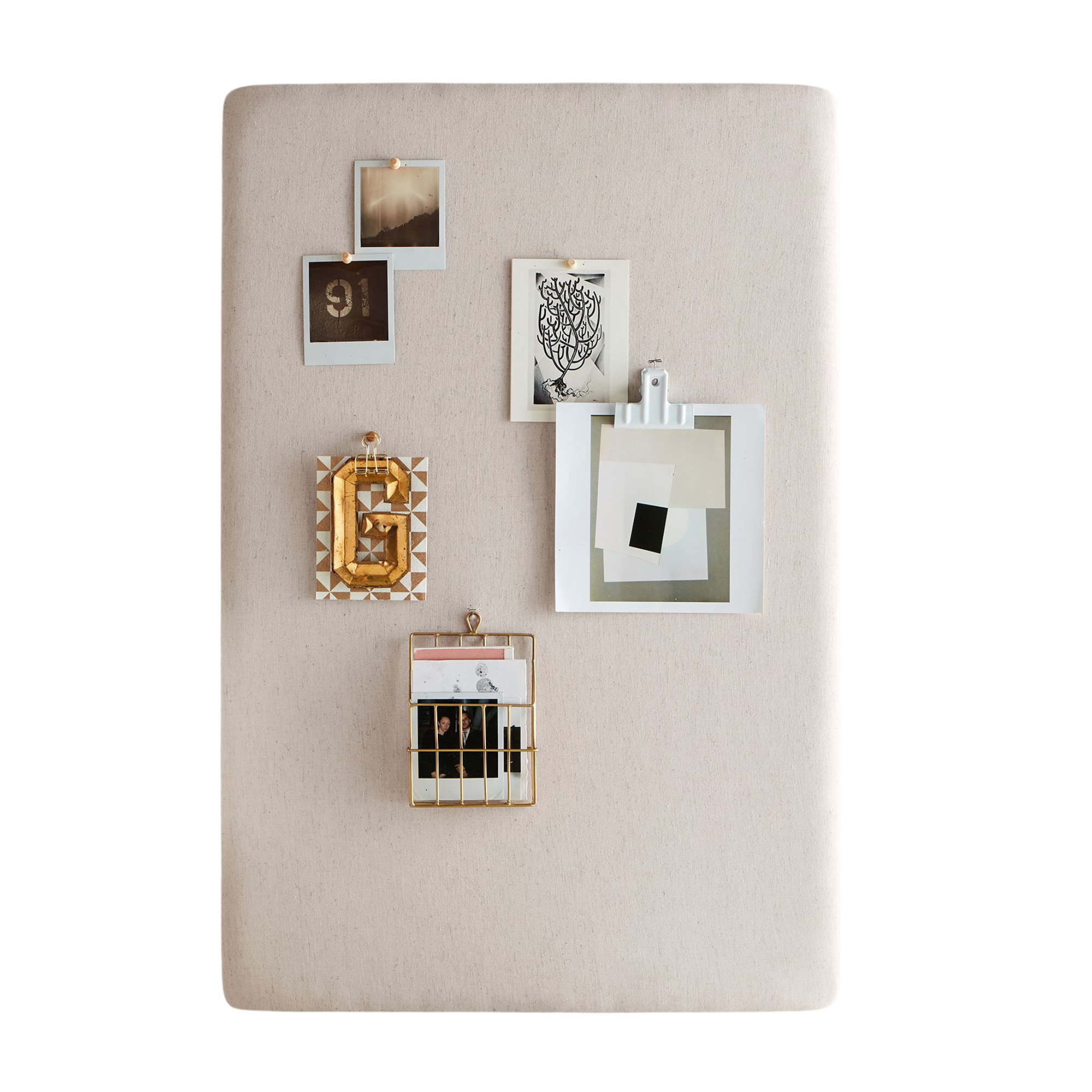 a pinboard holding various photos and artwork