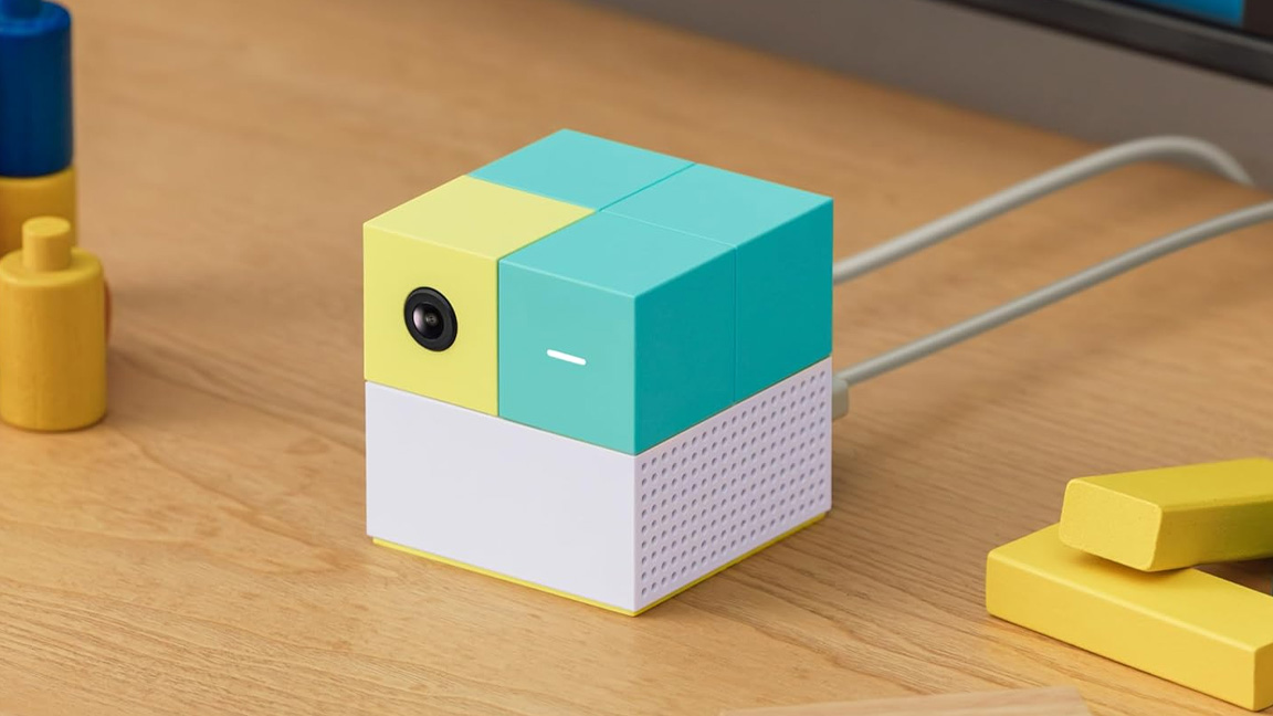 Nex Playground deal; a small square box on a wooden table