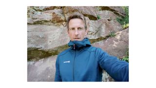 man wearing the Montane Isotope Hoodie
