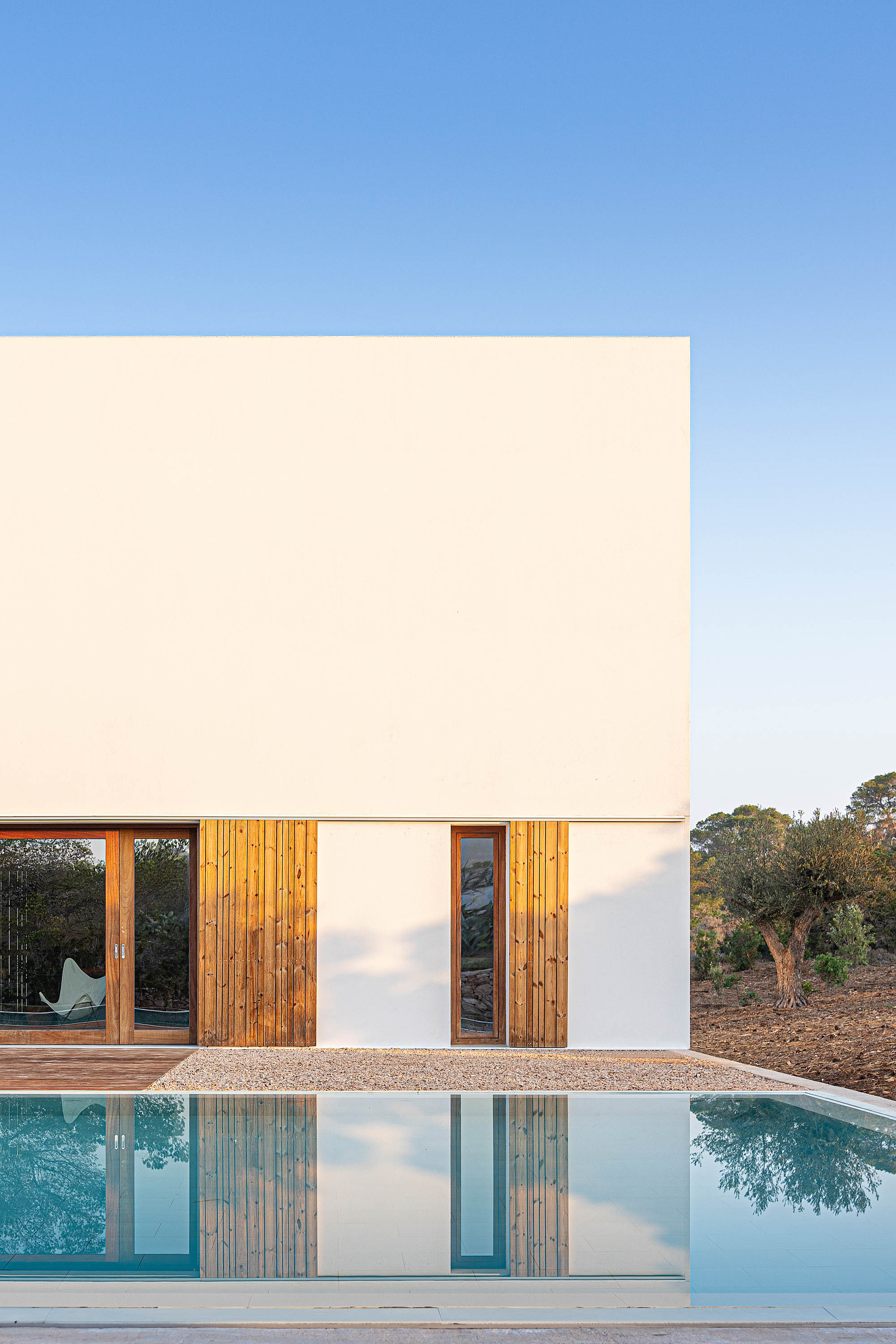 Formentera House by Mari&amp;agrave; Castell&amp;oacute;, a white concrete structure in the countryside
