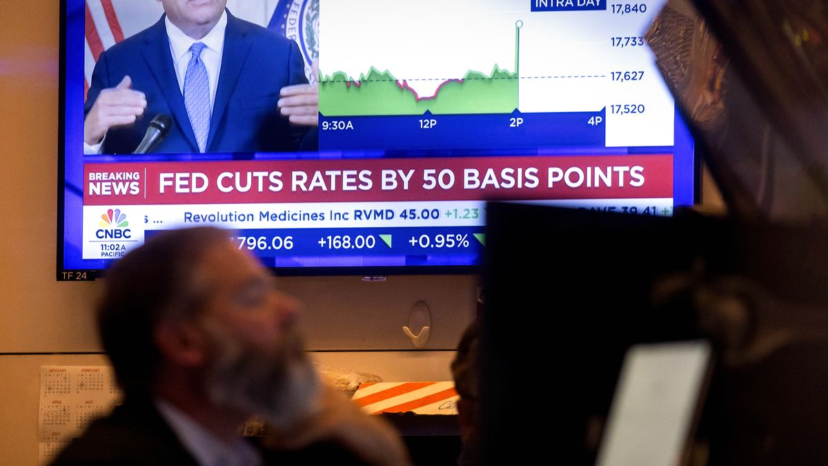 Fed cuts rates half a point, hinting victory on inflation