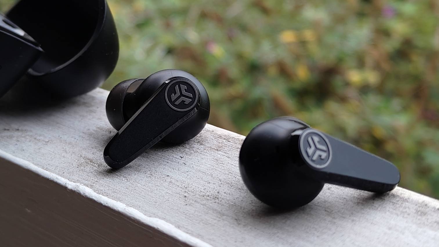 The JLab Go Pods ANC on a window sill.