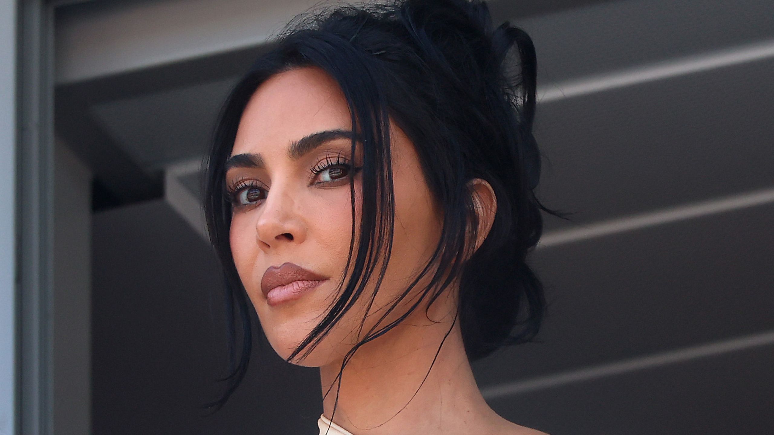 kim kardashian on a gray background