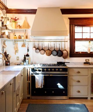 rustic kitchen with open shelves and copper pots on display