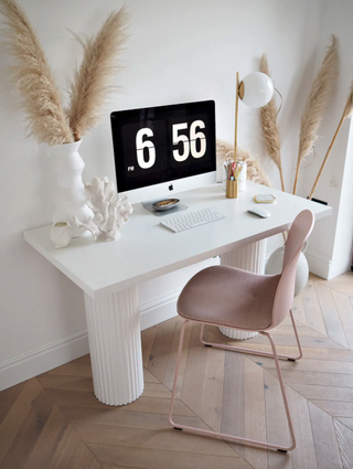 DIY desk with fluted legs and a pink desk chair