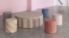 Rubber furniture installed in pink gallery space with concrete floor