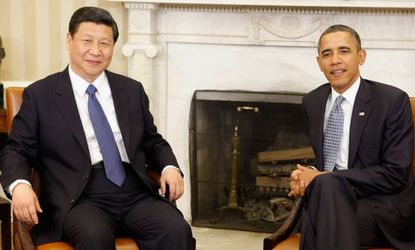 President Barack Obama and Chinese President Xi Jinping pose for photographs before meeting in the Oval Office at the White House February 14, 2012 in Washington, DC.
