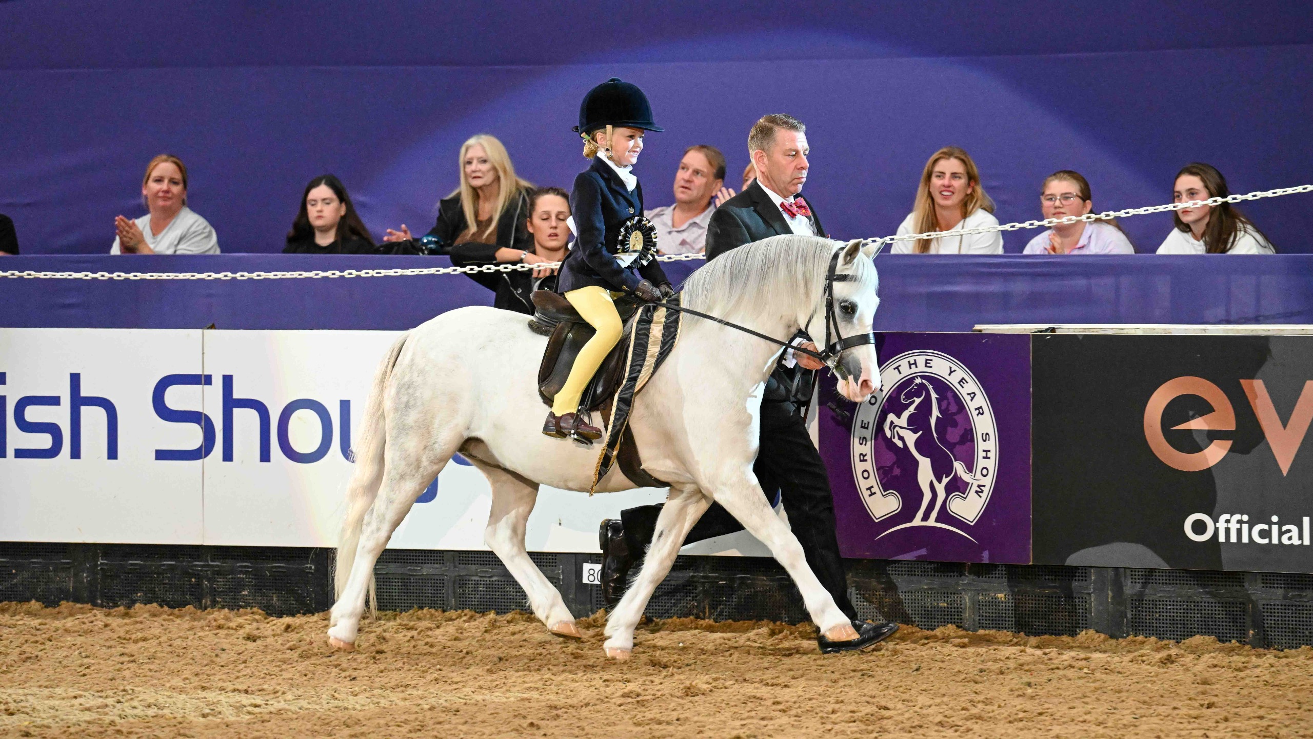 Thistledown Wood Owl carries Gracie-May Whitaker around the HOYS ring led by Craig Elenor