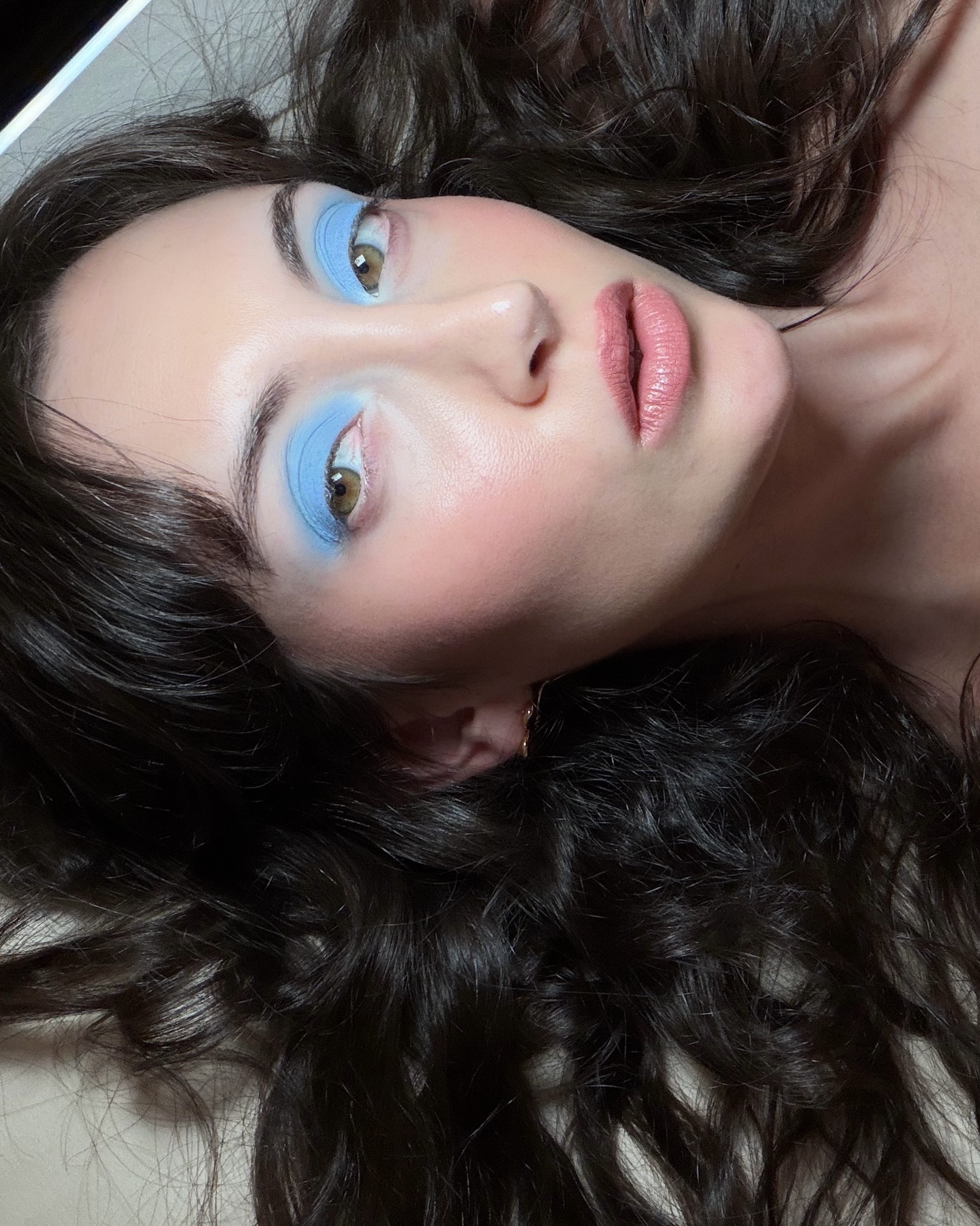 WWW associate beauty editor Alyssa Brascia wearing light blue eyeshadow.