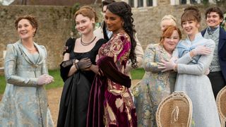 (L to R) Ruth Gemmell as Violet. Hannah Dodd as Francesca and Simone Ashley as Kate holding each other. Nicola Coughlan as Penelope hugging Claudia Jessie as Eloise. And Will Tilston as Gregory.