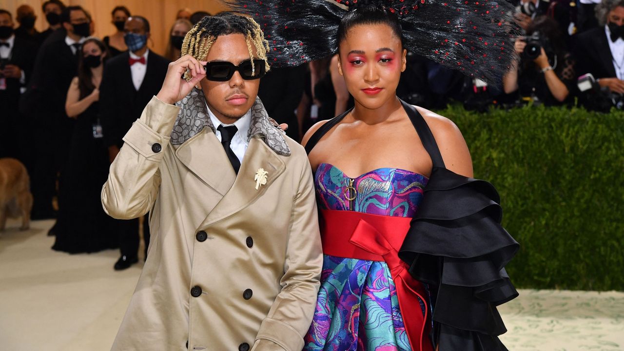 Japanese tennis player Naomi Osaka (R) and US singer Cordae arrive for the 2021 Met Gala at the Metropolitan Museum of Art on September 13, 2021 in New York. - This year&#039;s Met Gala has a distinctively youthful imprint, hosted by singer Billie Eilish, actor Timothee Chalamet, poet Amanda Gorman and tennis star Naomi Osaka, none of them older than 25. The 2021 theme is &quot;In America: A Lexicon of Fashion.&quot; 