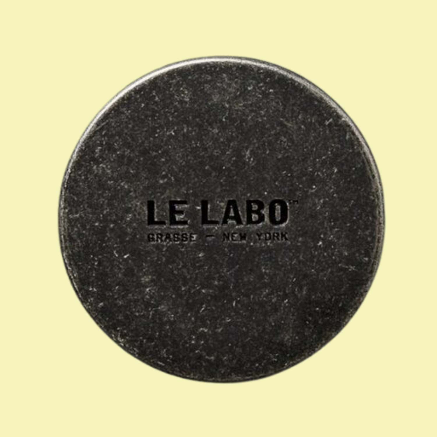 A distressed metal candle lid