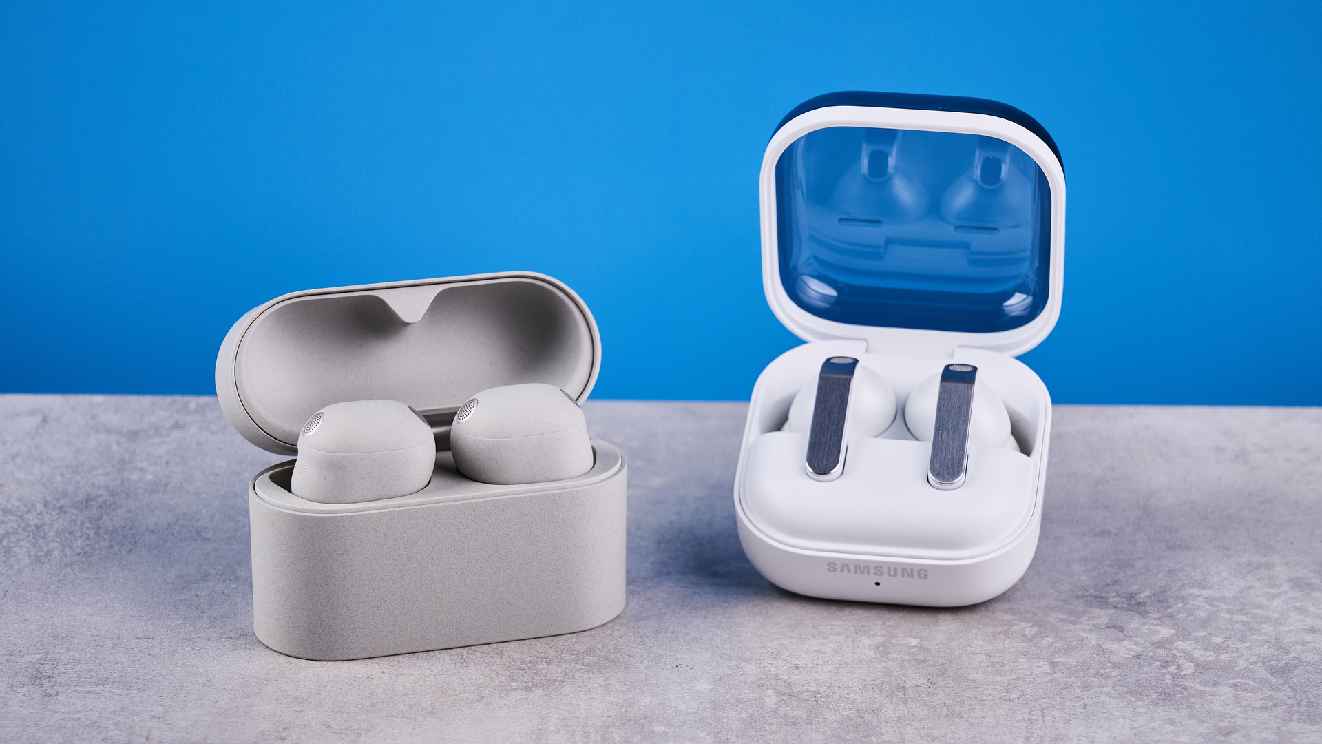 a photo of the samsung galaxy buds 4 pro and the sony wf-1000xm6 side by side against the blue tom's guide background