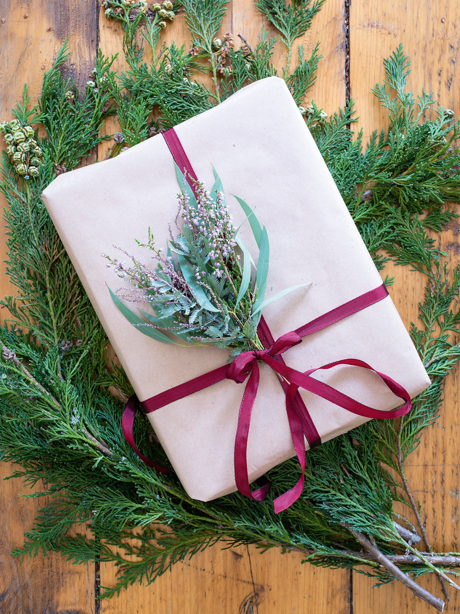 Gift box posy made using heather, eucalyptus and mimosa