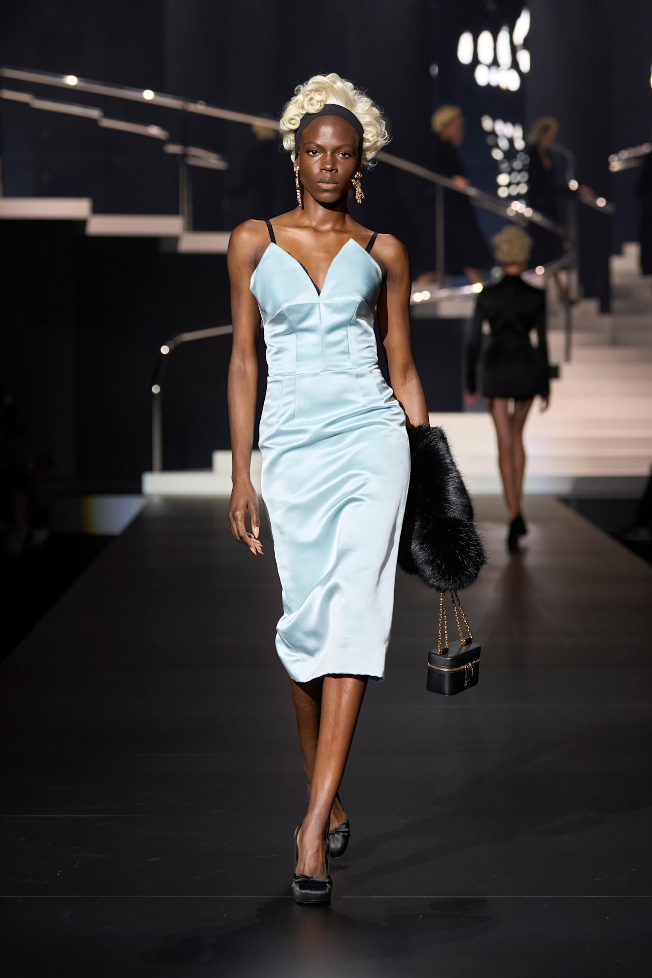 Model wears the baby blue color trend on the runway.