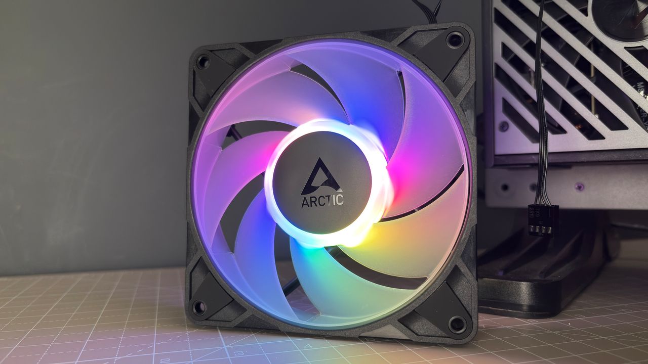 Various PC fans on a table with testing equipment for a round of batch tests.