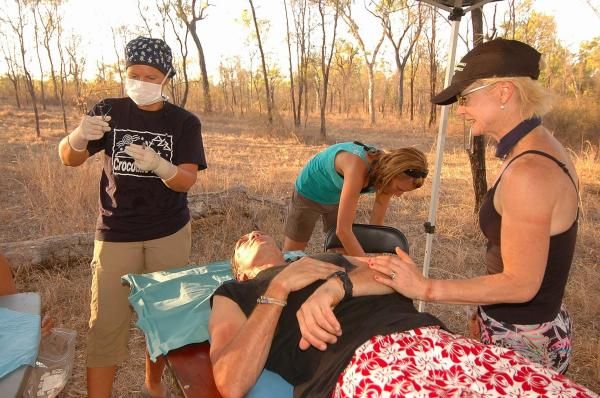 Doctor Andrew Graham revceives stitches from the official race doctor.